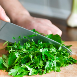 chopping herbs to cook